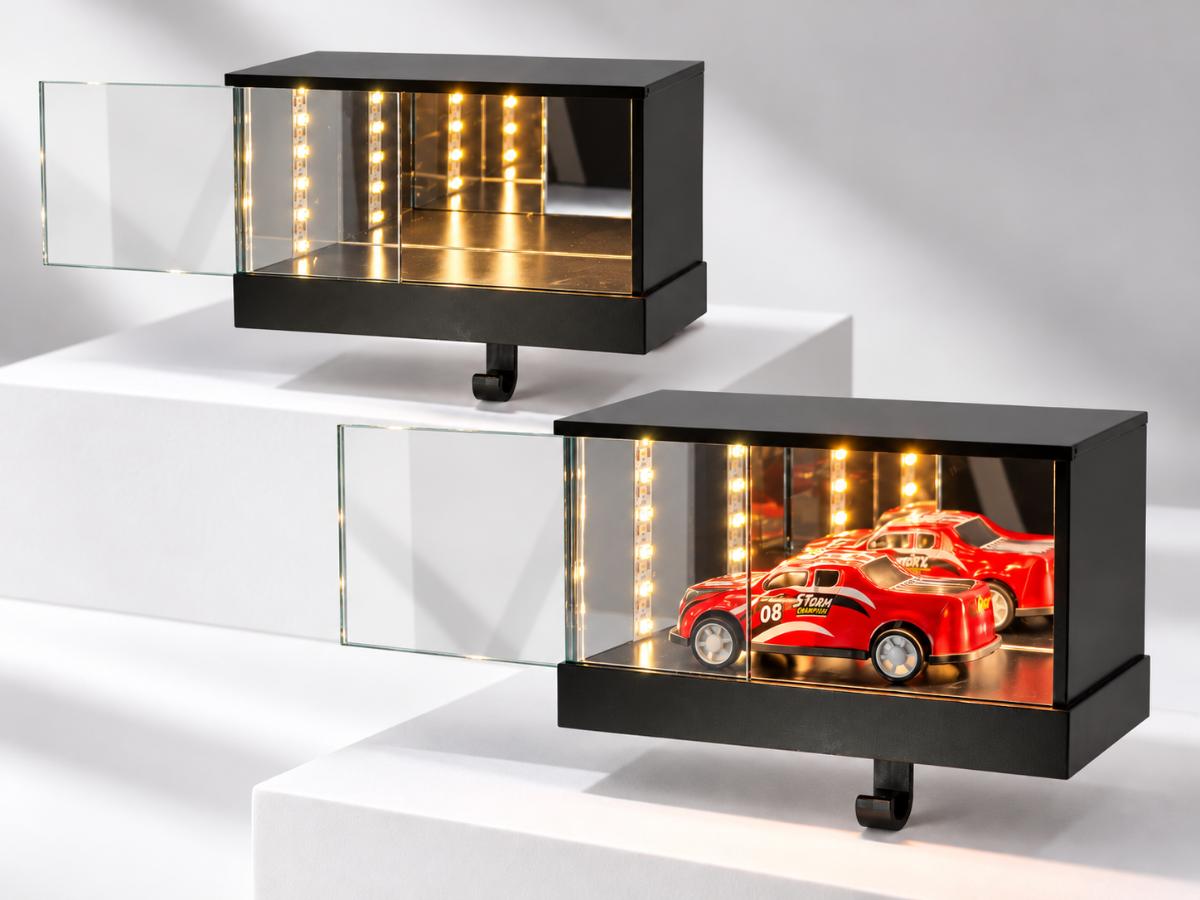 Two black mini garage display units with the front panel opened, showing the warm LED interior